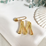Initial brooch M nz